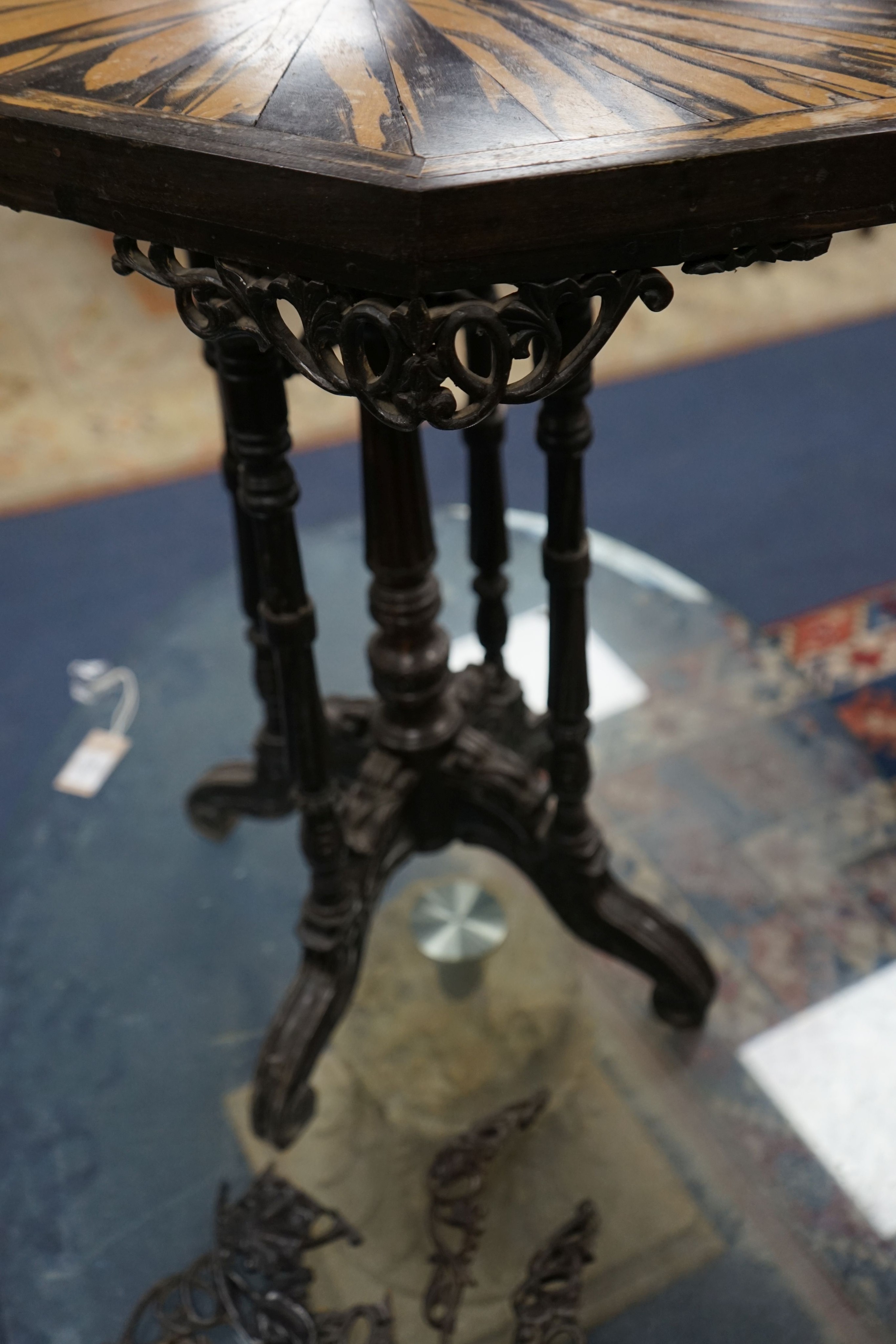 A 19th century Celanese carved ebony and coromandel veneered octagonal occasional table, width 57cm, depth 42cm, height 70cm